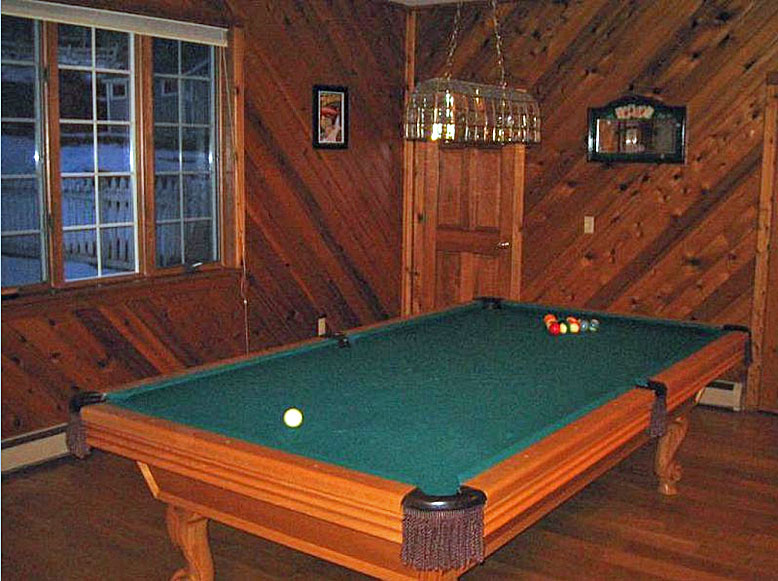 A pool table in a room.