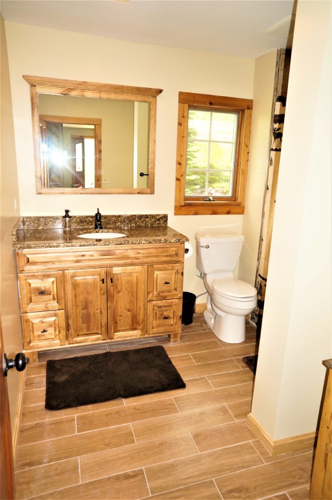 A bathroom with a toilet and a sink.