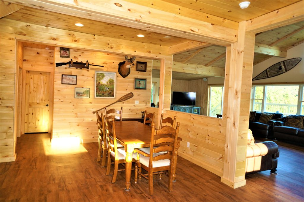 A dining room in a log cabin.