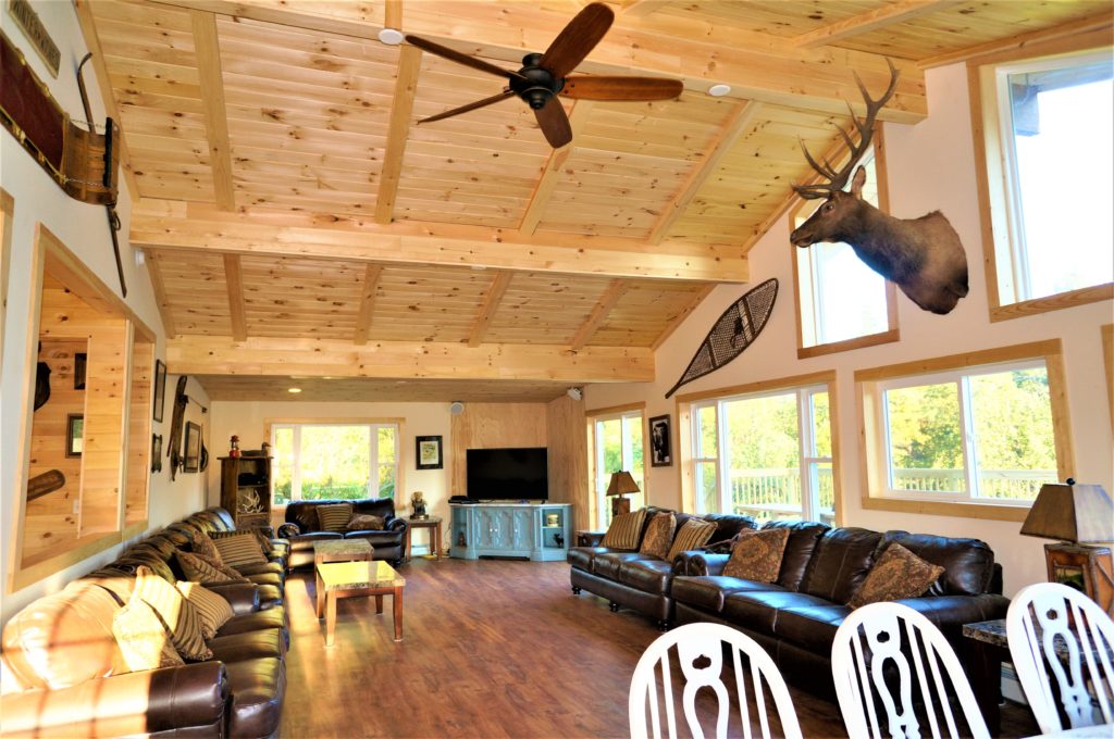 A living room with a ceiling fan.
