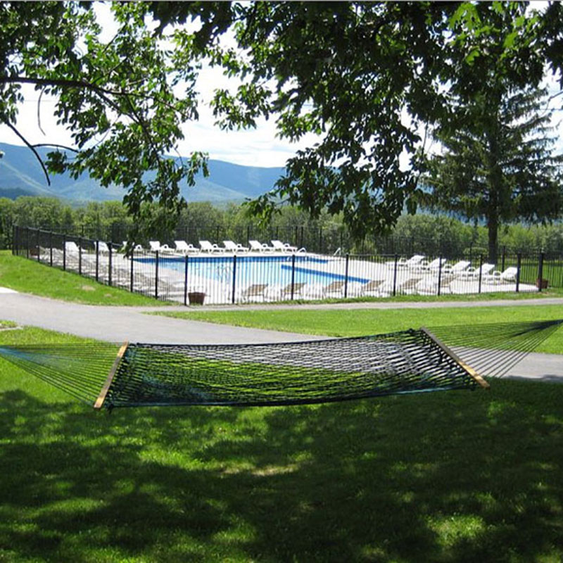 A hammock near a swimming pool