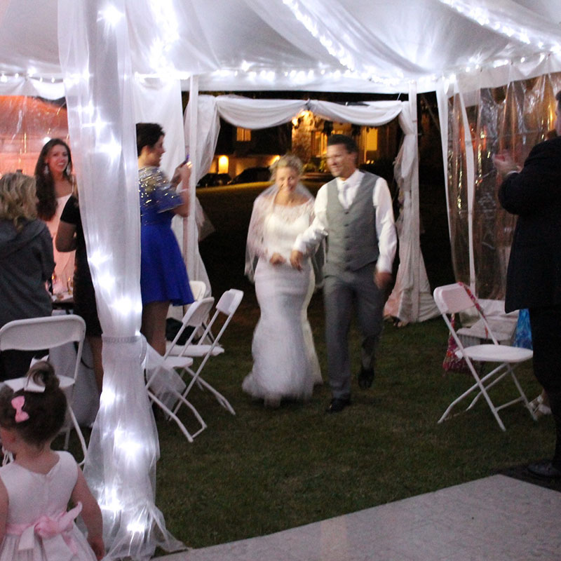 A white tent with white lights.