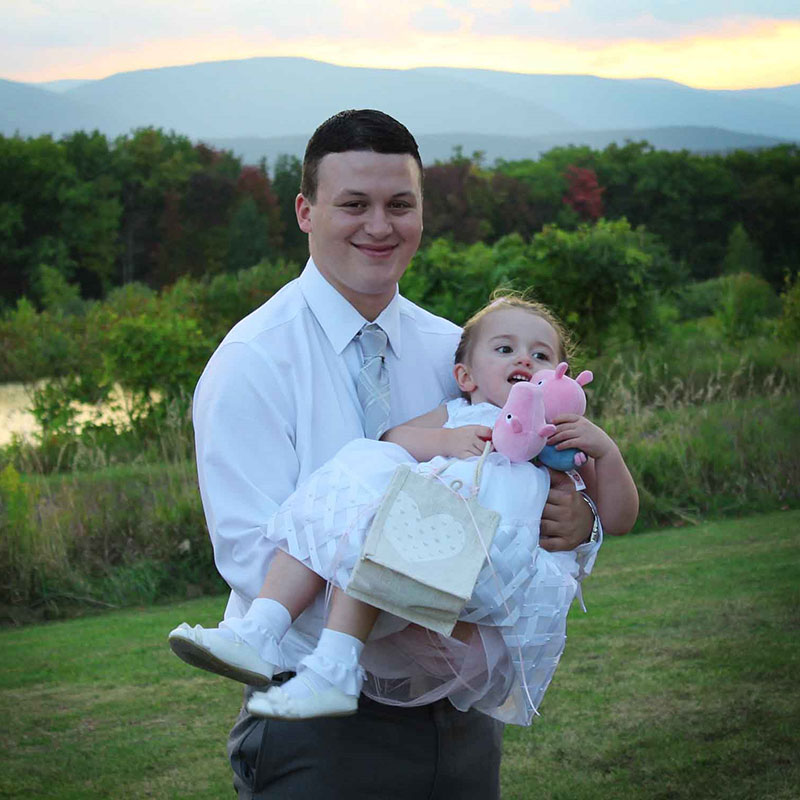 A man holding a little girl.