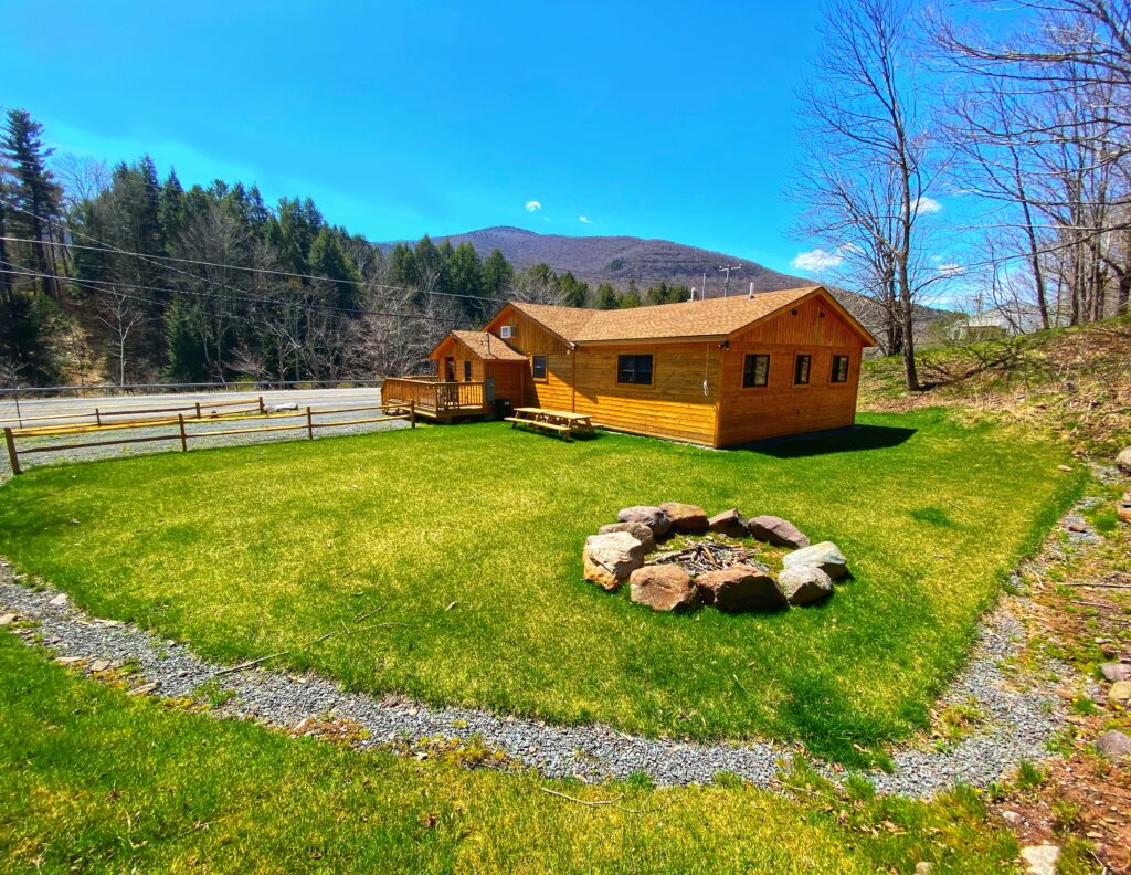 A cabin with an outdoor firepit