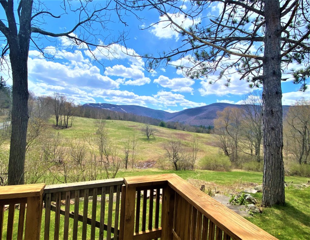 A view from the deck of a home in the mountains.