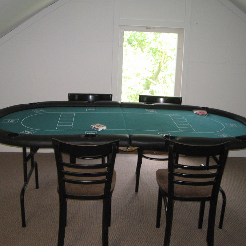 A poker table in a room.