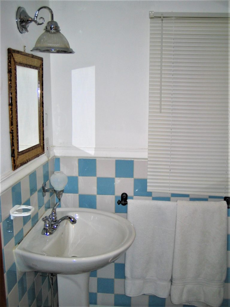 A white sink in a bathroom.