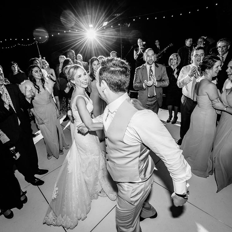 Black and white image of a bride and a groom, dancing